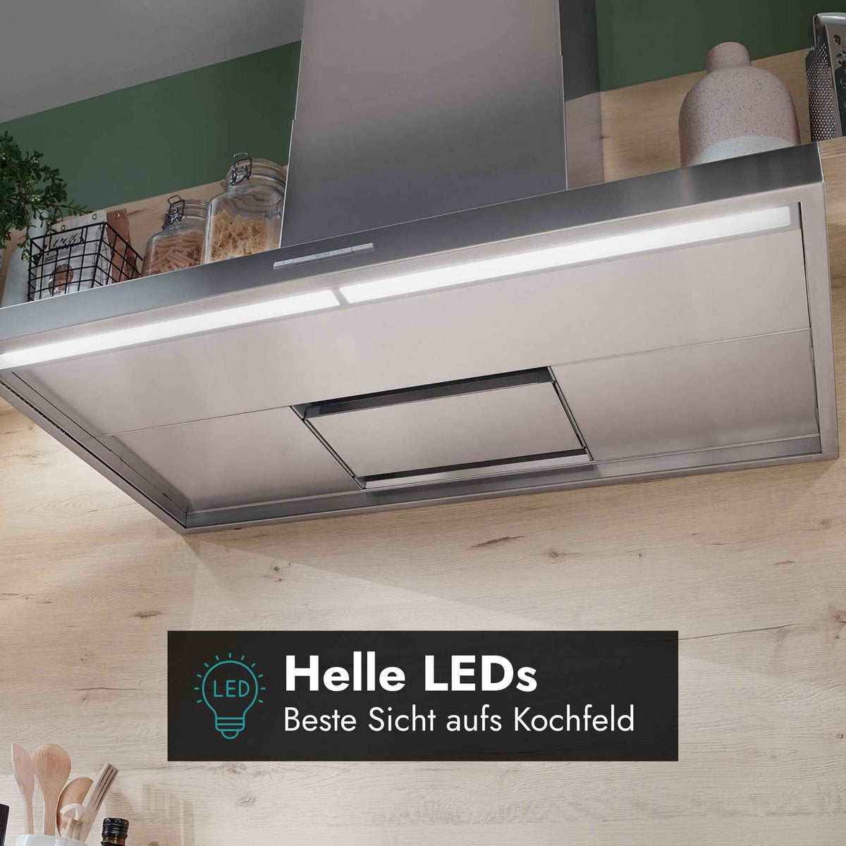 Detailansicht der Berbel Smartline BWH ST Wandhaube mit heller LED-Kochfeldbeleuchtung für eine gute Sicht beim Kochen.